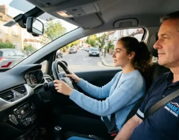 Is 20 lessons enough to pass? Learner driver practising with a Pharez Driving School instructor in a dual-control car with L plates